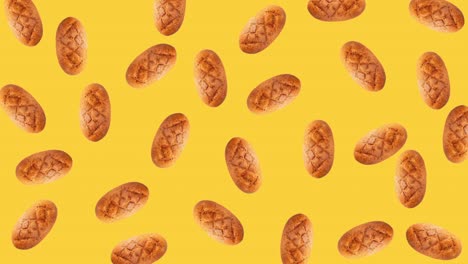 seamless looping animation of a whole diet loafs that wiggle top view. pattern of a bread above a yellow background, copy space