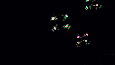 Bubbles-floating-on-black-background