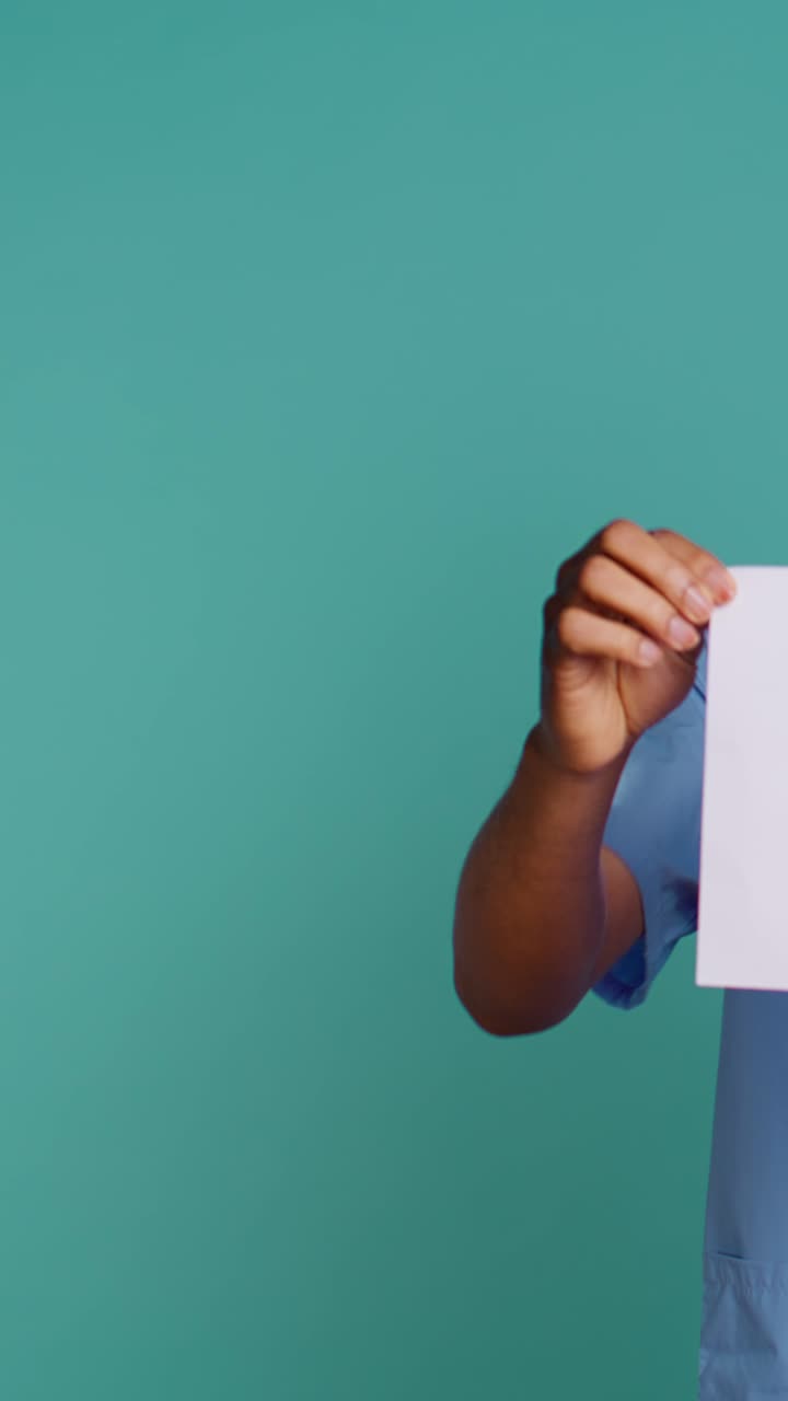 Medical Professional Holding 'Check Your Health Now' Sign