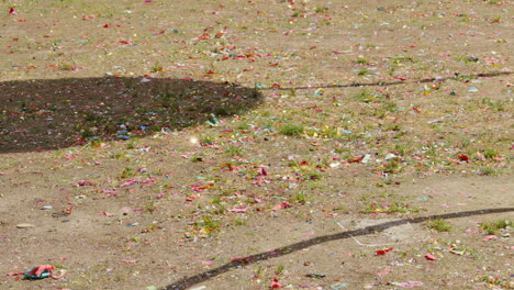 scattered confetti on ground after festival