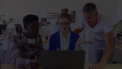 animation of diverse business people using laptop in office