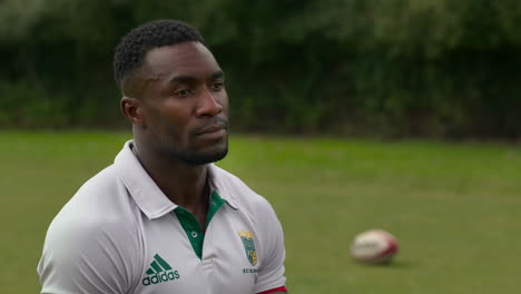 rugby player portrait on a field