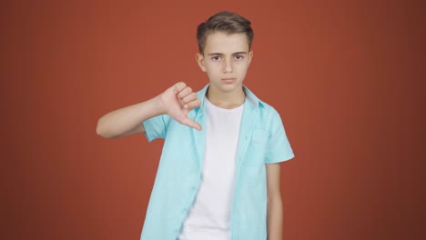 boy looking at camera with a negative expression.