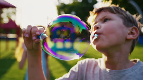 children playing with bubbles in a sunny park
