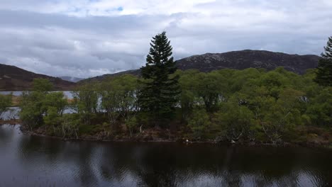 push-in droneshot of remote scottish lake island