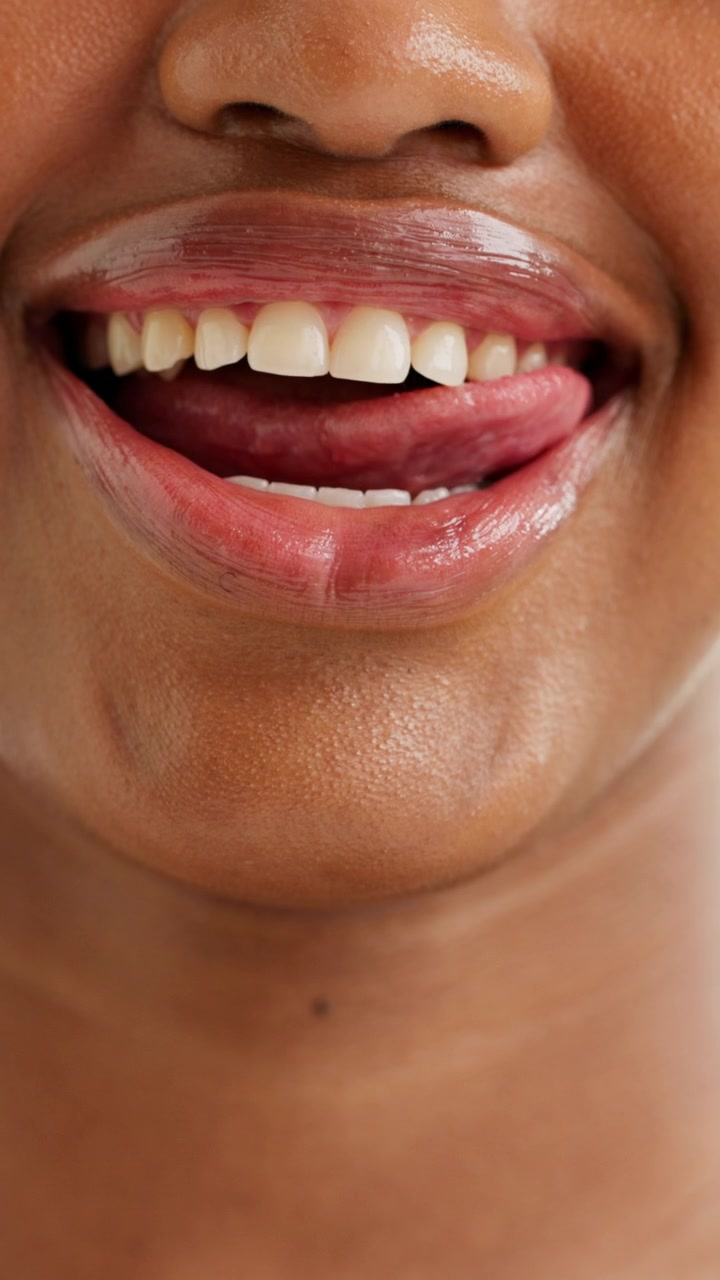 Close-up of a Woman Licking Her Lips