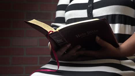 faceless black woman reading bible