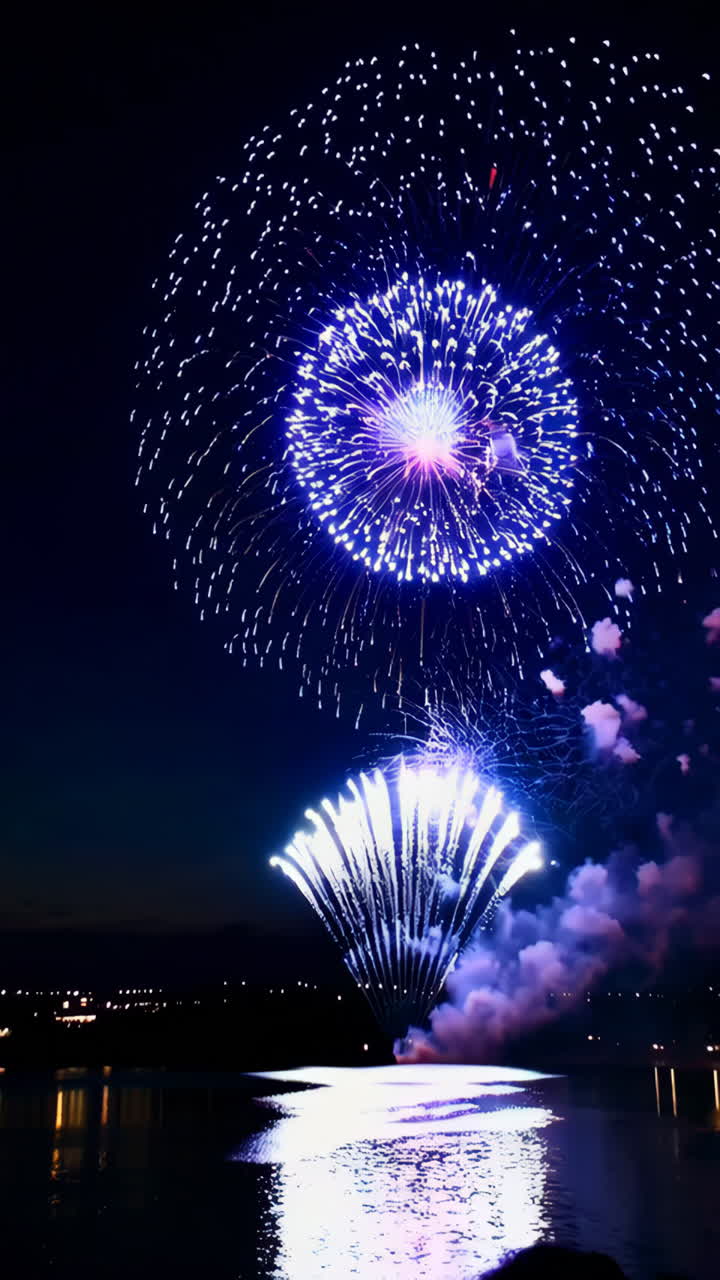 Spectacular Fireworks Display Over Water at Night