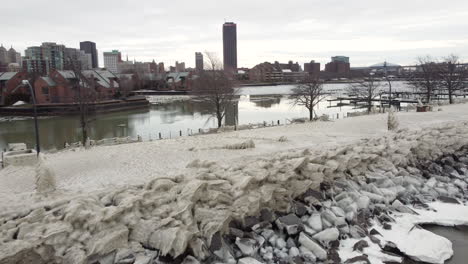 Drone-footage-of-city-covered-in-ice-and-snow,-city-struck-by-winter-storm