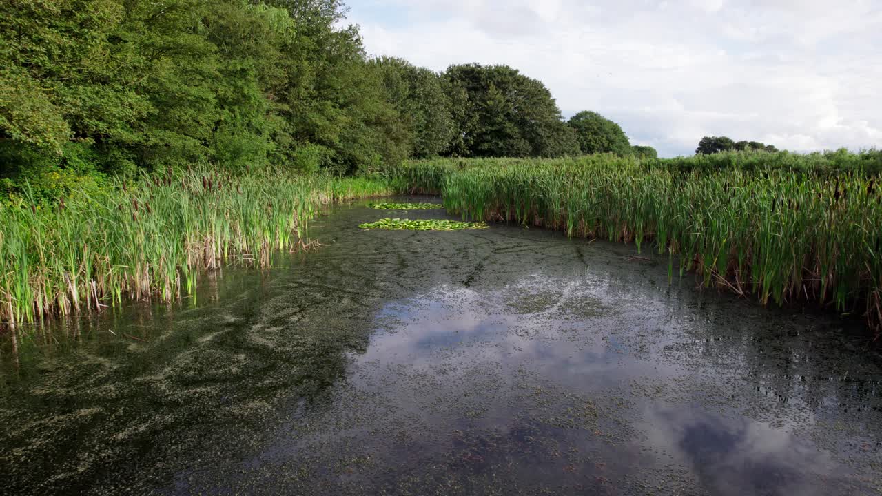 Aerial video footage of the remains of Bolingbroke Castle a 13th century hexagonal castle, birthplace of the future King Henry IV, with adjacent earthwork