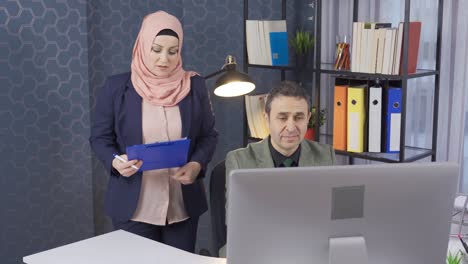 muslim woman in hijab is the boss and oversees the work.