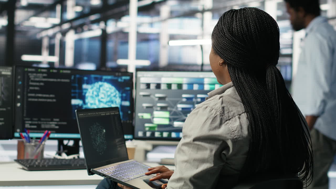 Server room IT expert using laptop to apply artificial intelligence technology