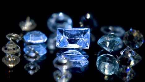 Macro-shot-of-gems-and-diamonds-shining-on-revolving-table