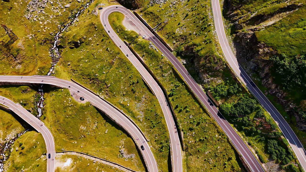 Aerial of Transfagarasan road curves in Romania. Tight serpentine curves of the Transfagarasan road in the Carpathian Mountains