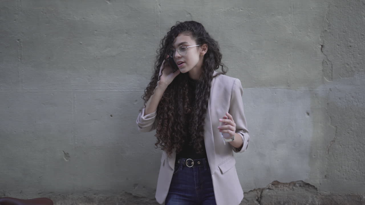 Woman talking on phone near a bicycle