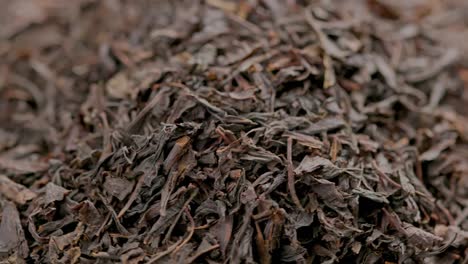 looped spinning dry black tea full frame close-up background