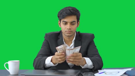 Indian-manager-counting-the-money-Green-screen