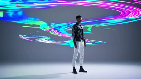 stylish man in modern studio with light painting background