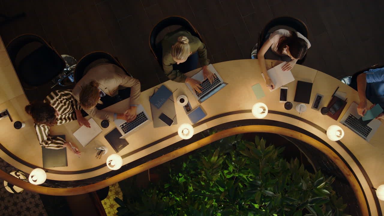 Creative people finishing work in office. Business people leaving office.