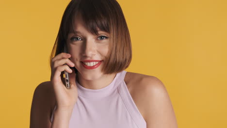 happy young woman talking on the phone