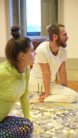 couple doing yoga at home