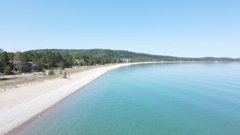 Private-homes-along-side-of-sandy-coast-of-lake-Michigan,-aerial-drone-view