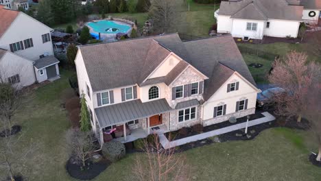 Large-home-with-American-flag-waving-in-America