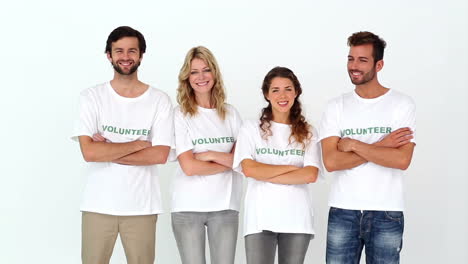 team of volunteers smiling at camera