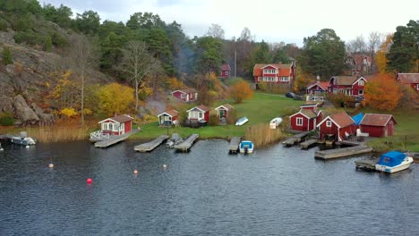 picturesque wooden cabins in a lake near sockholm baltic sea drone landscape