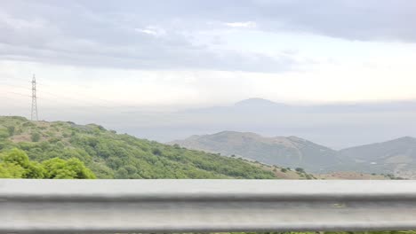 car driving fast on highway near stunning mountains landscape