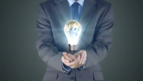 businessman presenting light bulb with hands