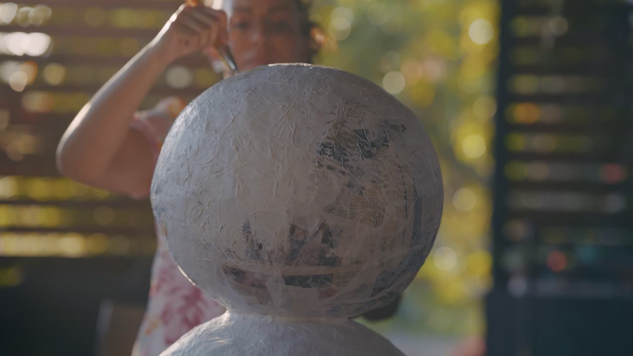 Woman Painting a Sphere Craft