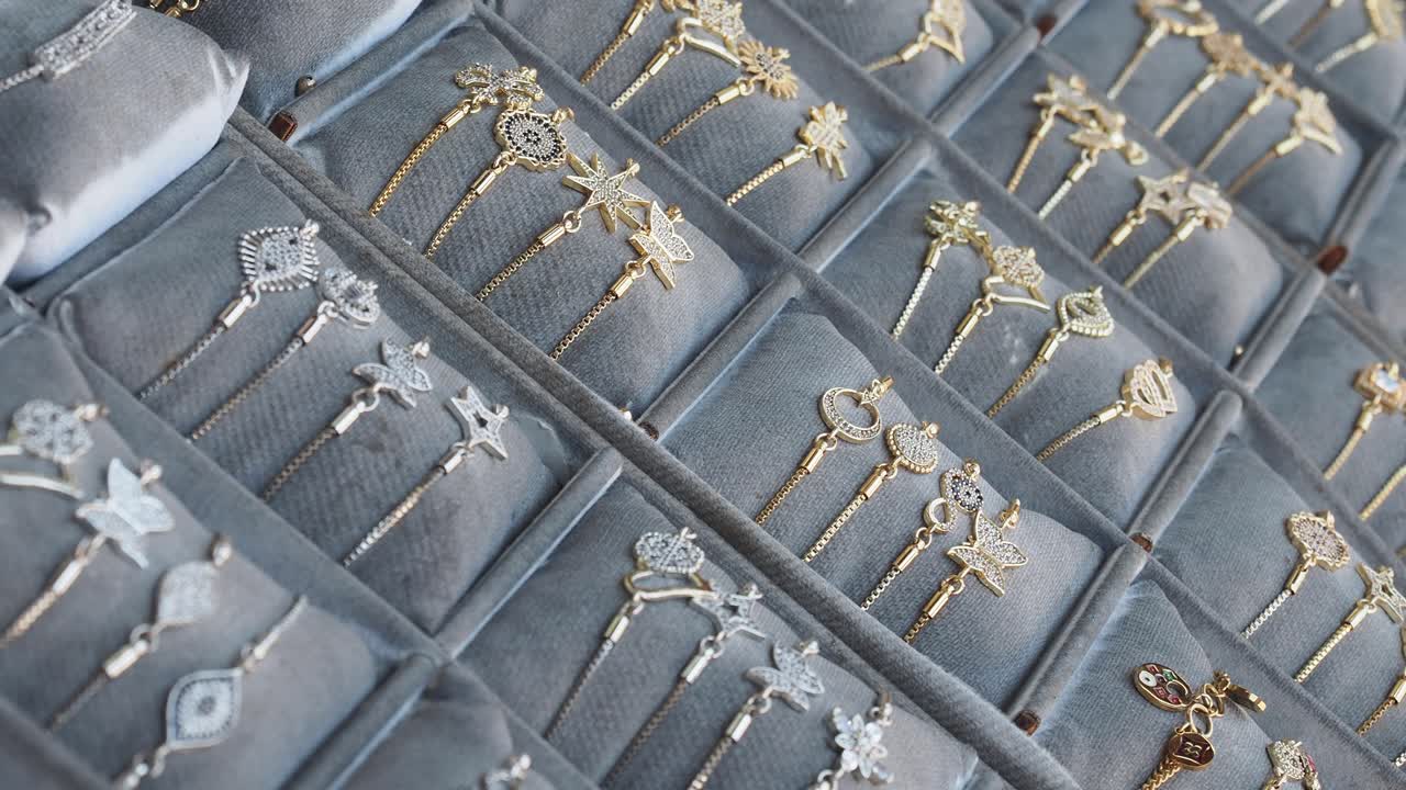 A display of gold and silver bracelets