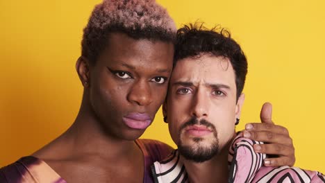 Multiethnic transgender and gay men looking at the camera with a serious look