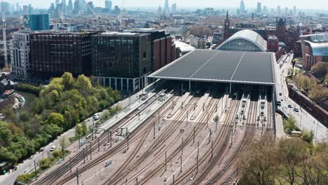 rising pan down drone shot of train tracks from london st pancras station