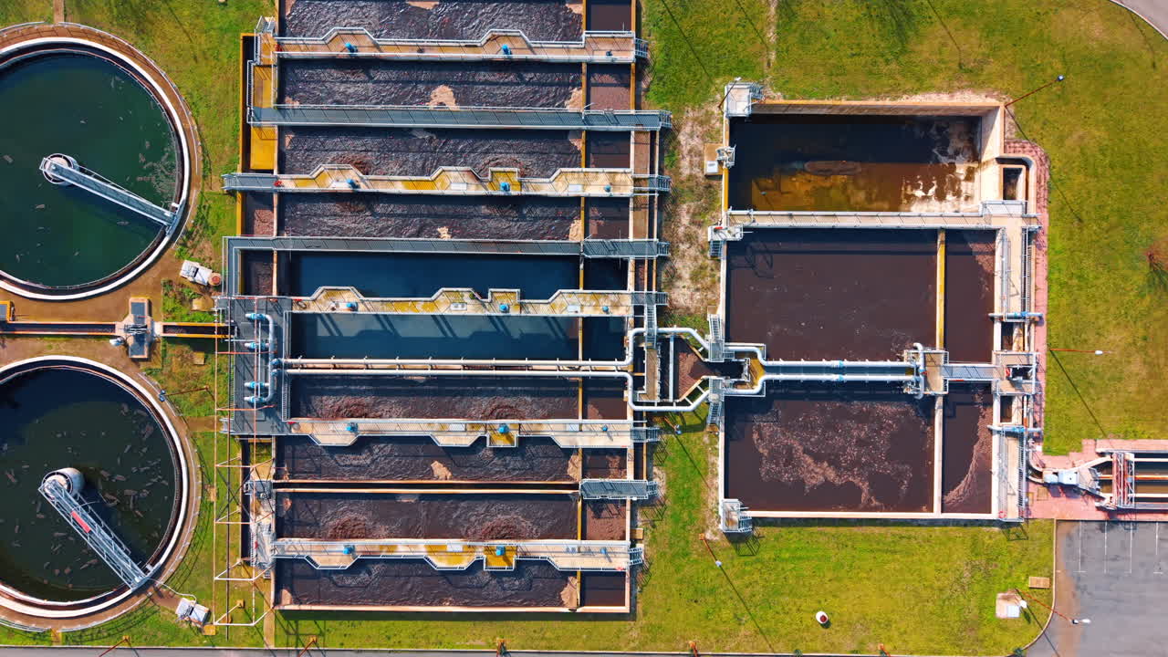 Water treatment facility in operation. Several tanks used for treating water. The structure is part of a water management system