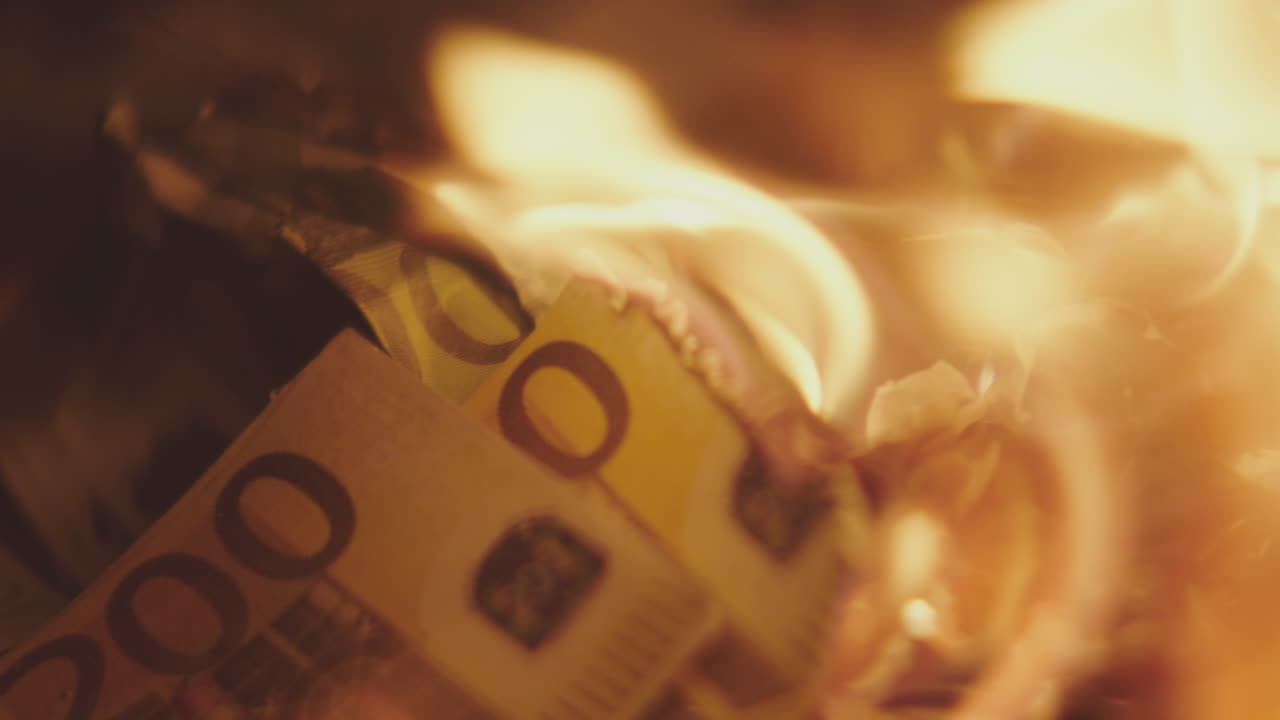 Burning Euro Banknotes: A Symbol of Financial Loss