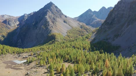 drone-flying-above-the-mountains,-forward-movement-tilting-down