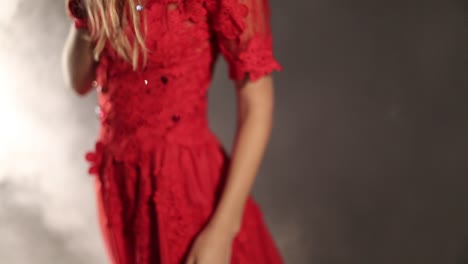 young girl posing on foggy. young girl in long red dress posing on foggy