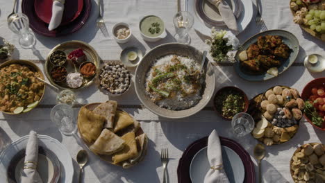 overhead view of a beautiful indian food spread on an outdoor dining table