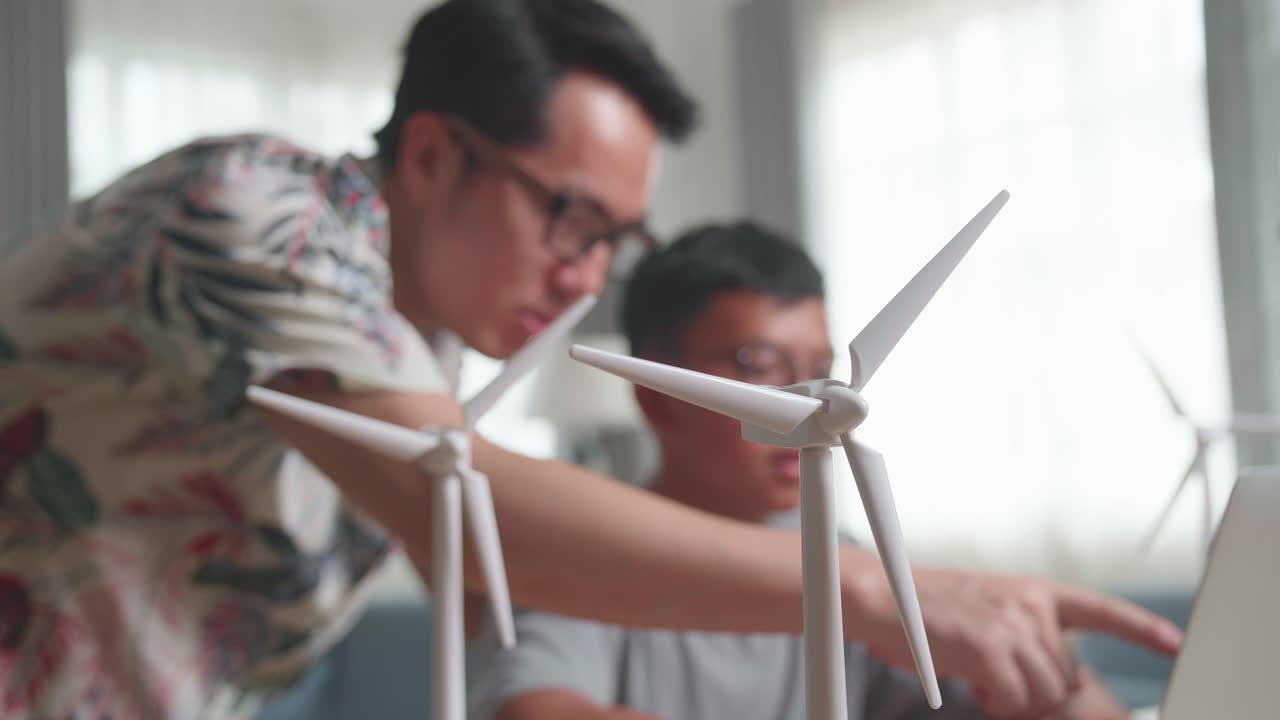 Father and son learning about renewable energy