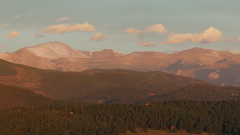 cinematic aerial drone helicopter first snow on denver mount blue sky evans 14er peak early autumn fall beautiful golden yellow morning sunrise day colorado rocky mountains circle slowly right motion