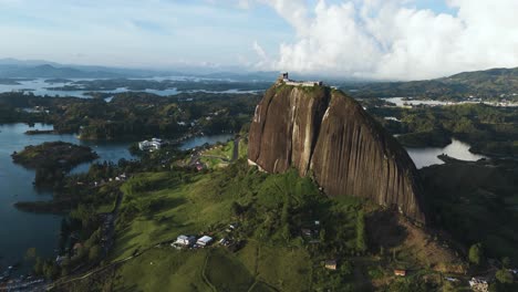 guatape monolith mountain at sunset, beautiful aerial drone view