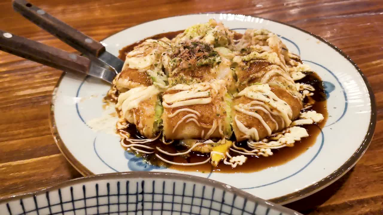 Okonomiyaki and Japanese cold noodles cuisine in a traditional Japanese restaurant in Hong Kong