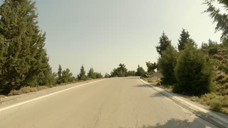 curvy road at the countryside of kos island during summer in greece