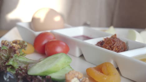 breakfast platter with dips and fresh vegetables