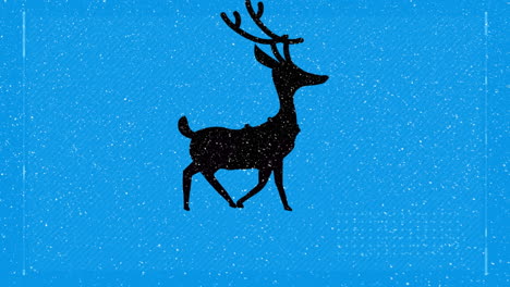 snow falling over silhouette of reindeer walking against blue background