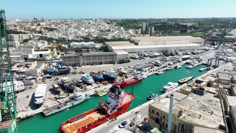 establishing aerial shot over a a busy shipyard revealing a top view