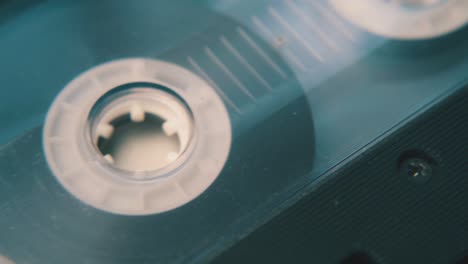 retro compact cassette in black case on white background