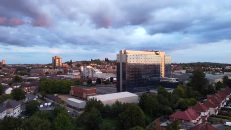 drone shot rising up over a north london suburb at sunset, england